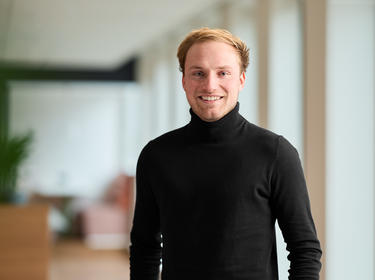 Miel Aerts standing in an office