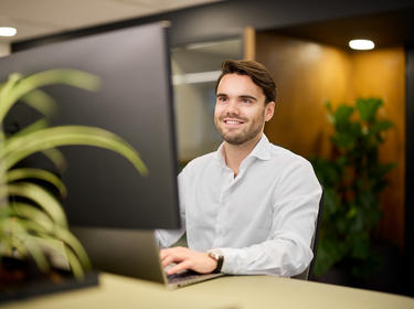 Prologis employee looking at a monitor