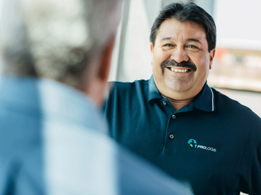 Man in a Prologis polo smiling